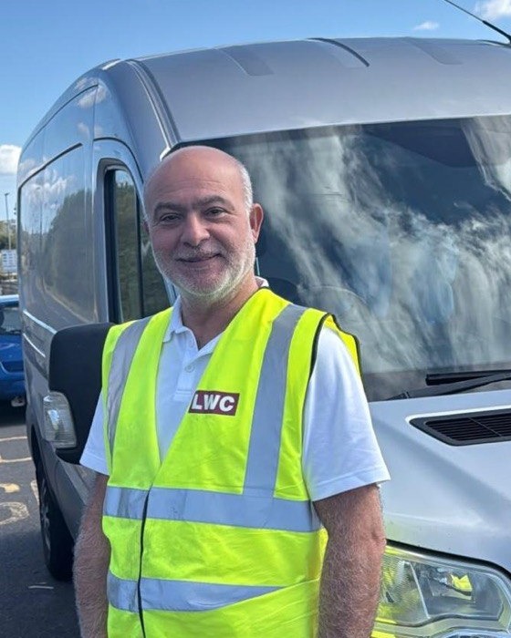 Ali, Mr Logistic driver, standing beside a van